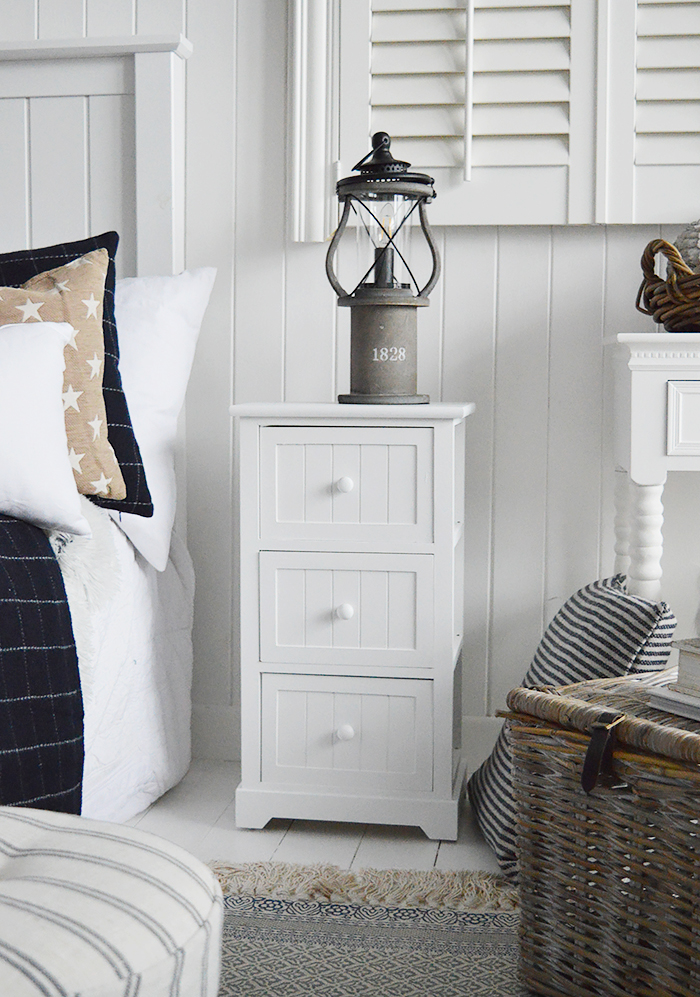 Maine white bedside table with 3 drawers for white bedroom furniture. New England country, coastal and city bedroom interiors from The White Lighthouse