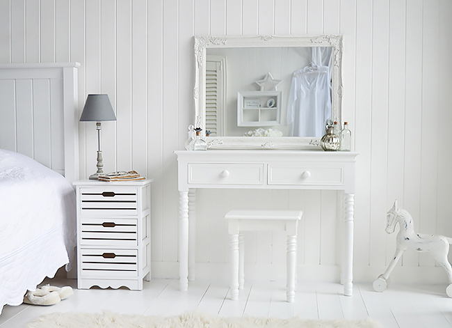 A phot of the New England vanity with an over sized mirror. Perfect for those that love to see themselves!