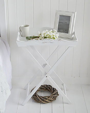 Guest room white bedside table